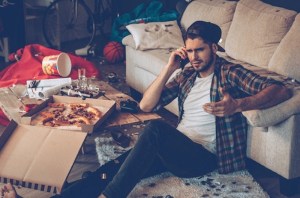 attractive guy on floor upset on the phone cleaning up for love