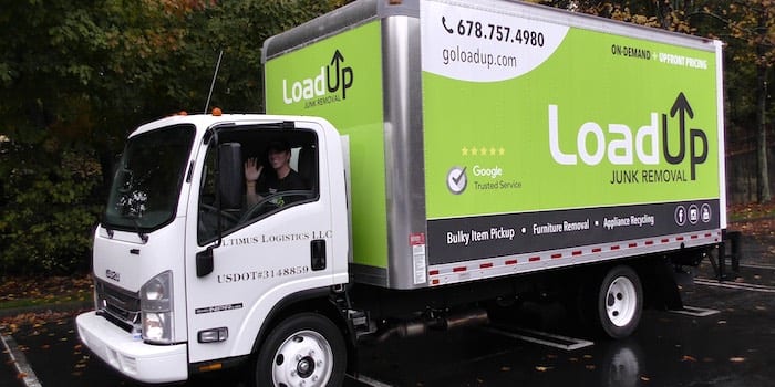 Box truck used for junk removal jobs, branded by LoadUp.