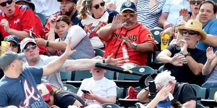 Dad saves son from bat