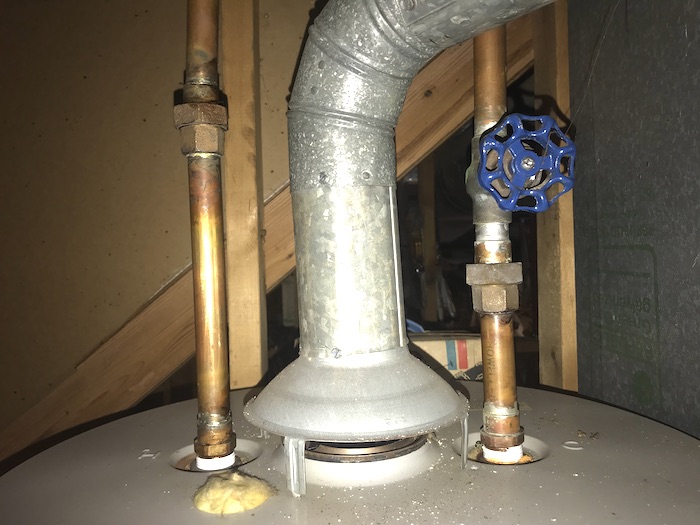 Hot and cold water supply lines coming out of old water heater