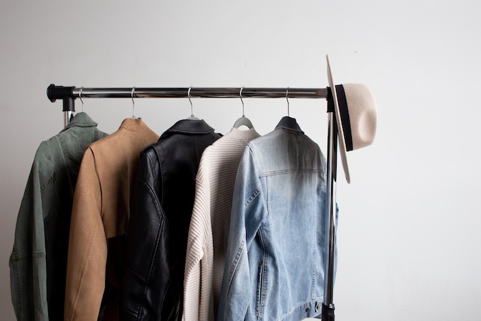 capsule wardrobe clothing wrack with five items on it