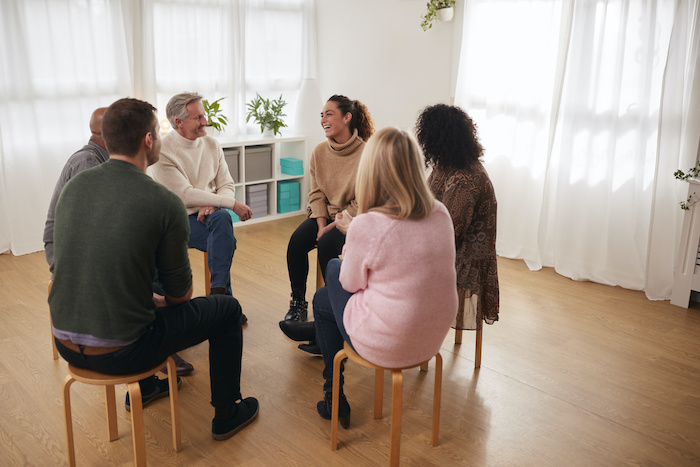 Support group meeting at rehabilitation center