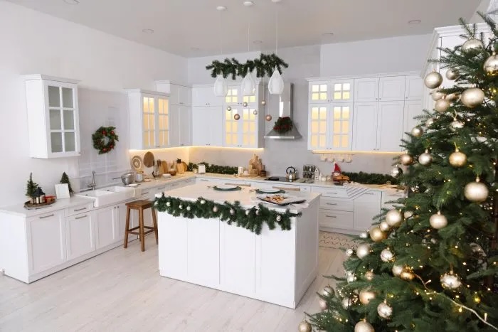 Organized clean white kitchen with holiday decorations. 