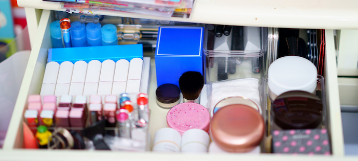 Makeup neatly organized in a drawer.