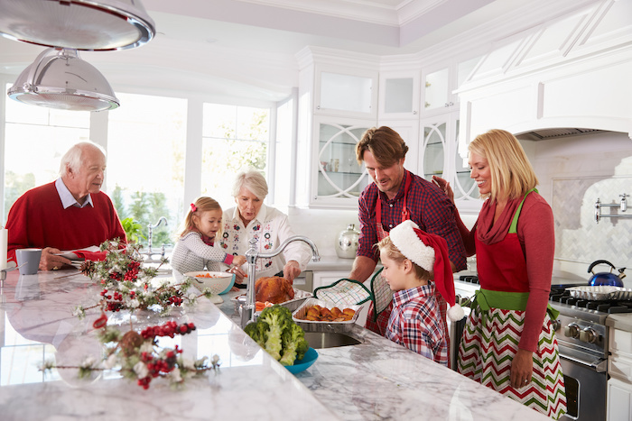 Family preparing for Christmas in the kitchen.