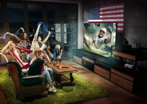 Friends gather for a Super Bowl party in the living room