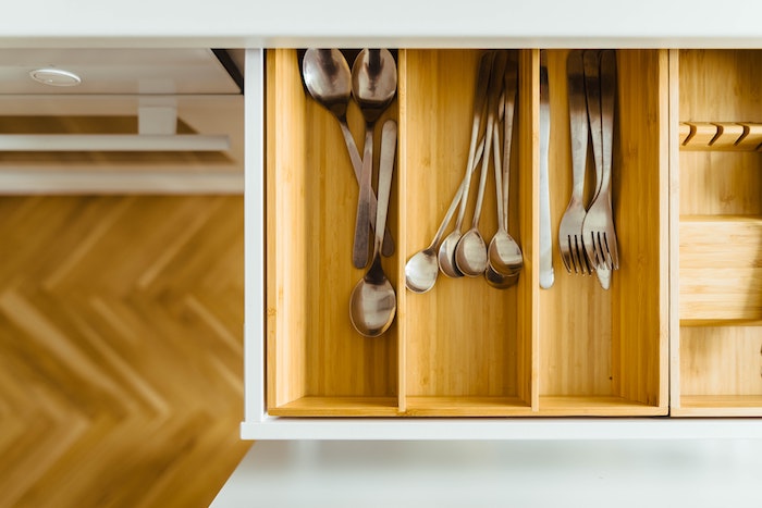 Organized utensils in a bamboo drawer organizer