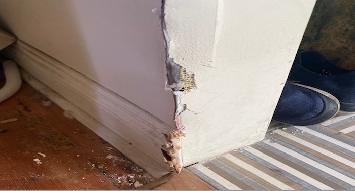 Example of drywall damage to the corner of a wall.