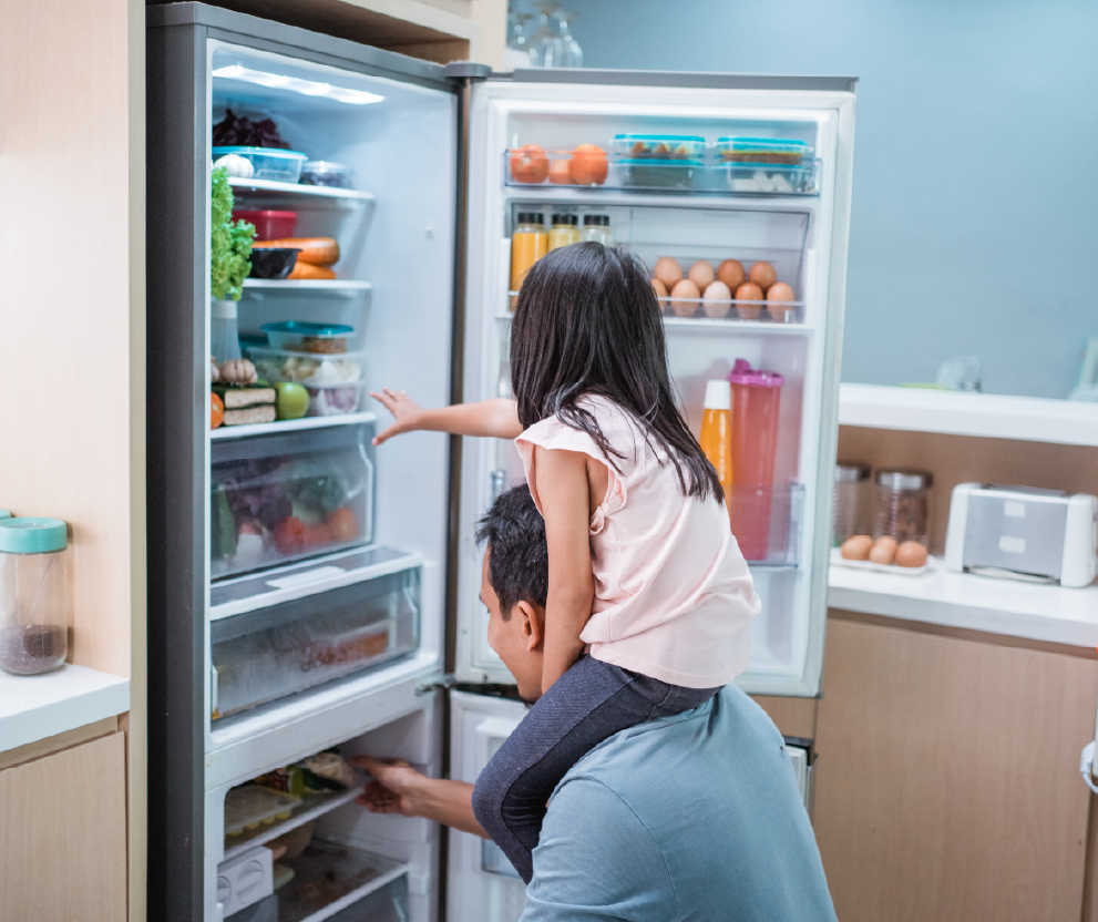 dad and daugher using fridge