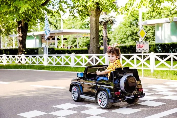 Child riding on a newly assembled toy car