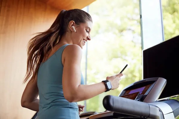 Woman running on newly assembled treadmill