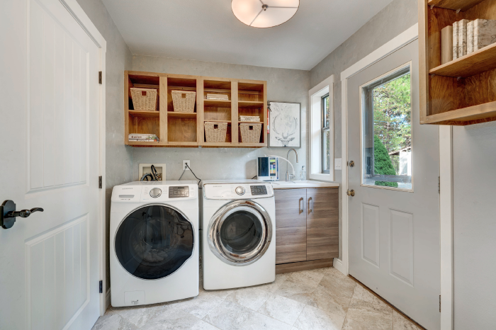 Laundry room wall storage ideas including floating shelves and pegboard organizers
