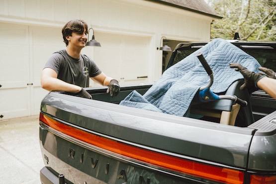 removal and assembly pro hauling away an old piece of exercise equipment for a customer