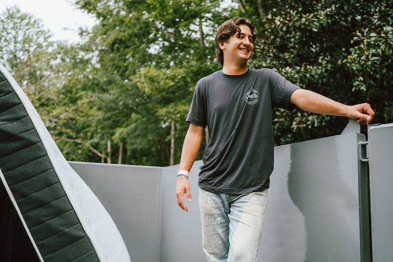 Pro Loader on the job loading a mattress into a trailer