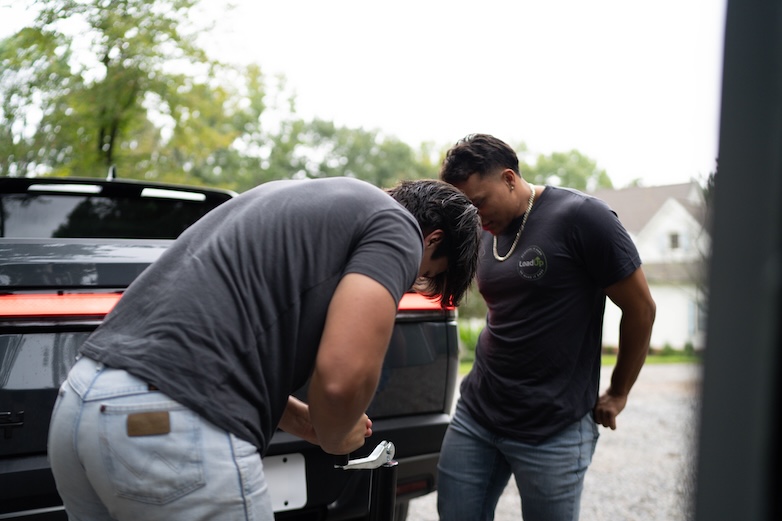 Two Loaders working on truck