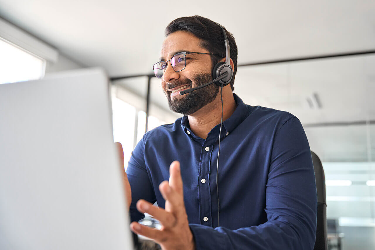 Man wearing headset a computer