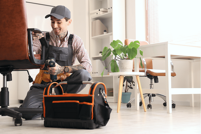 Handy man assembling office furniture for a B2B partner