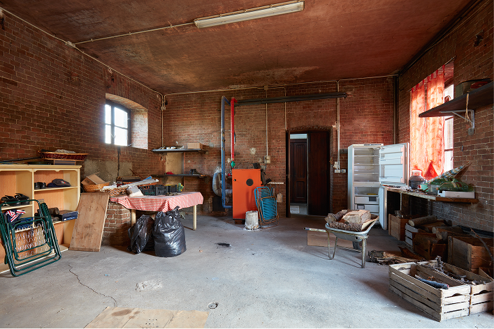 Basement that is in the process of being cleaned out by junk removal pros